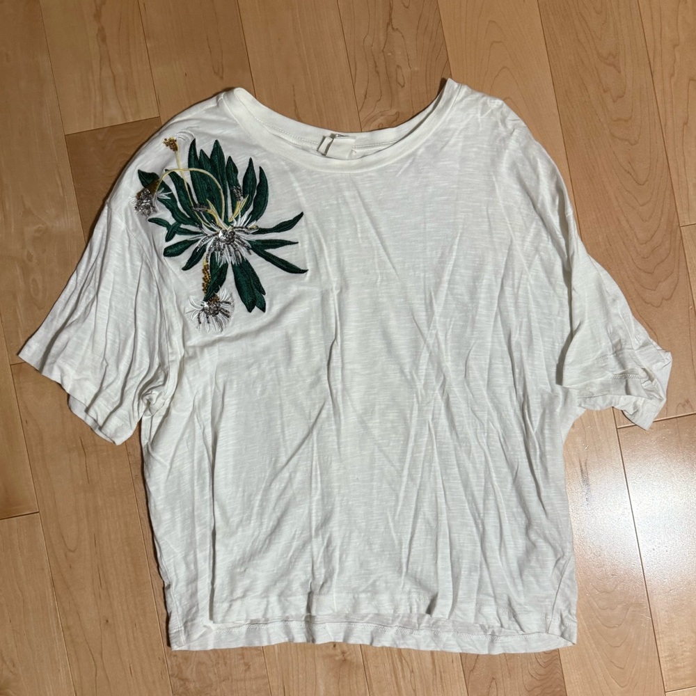 H&M shirt with beaded design.